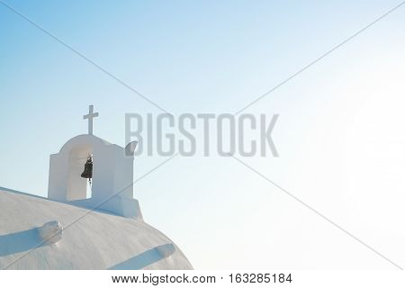 White church against blue sky in Santorini island Oia Greece
