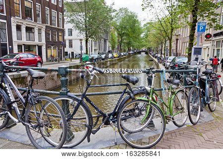 Bicycles Parked On Paulusbroedersluis Bridge In Amsterdam