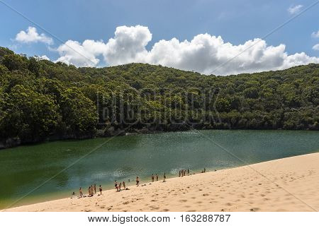 Landscape of people enjoying Lake Wabby in Fraser Island, Queensland, Australia