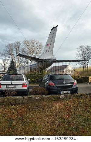 Petrovice Ustecky kraj Czech republic - december 10 2016: black car Opel Astra parked near the airliner Tupolev T-104 as a restaurant