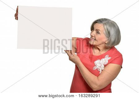 mature woman holding empty placard, against white background
