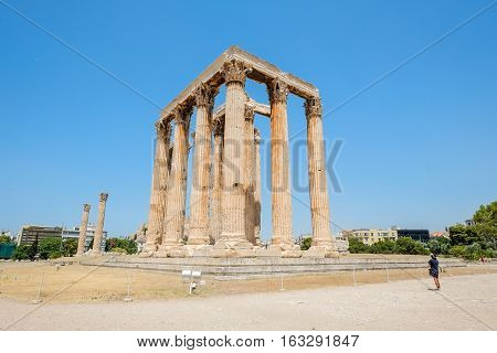 Looking up view of famous Greek temple pillars against clear blue sky in Temple of Zeus Greece