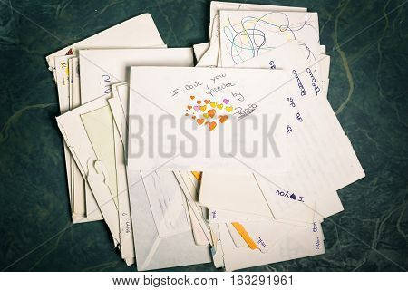 Big stack of mails pile of papers or heap of letters above a letter saying 