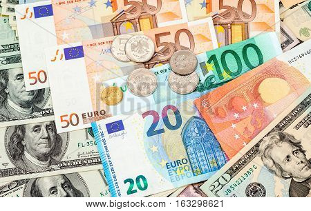 Russian rubles coins over different currency banknotes close up