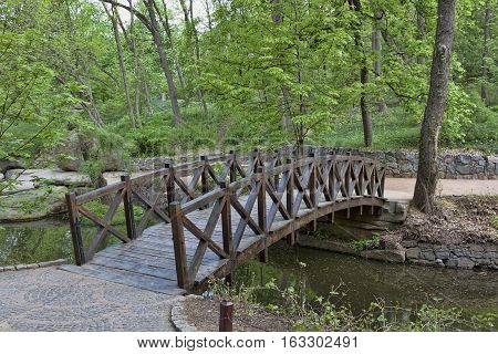 Wood bridge in Sofiyivsky Park. Northern part of the Uman city Cherkasy Oblast Ukraine.