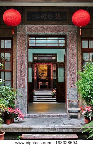 Xiluo, Taiwan - Mar. 12 : Traditional oriental chinese heritage building with spring couplets&red lantern in Taiwan (Chinese Translation on board : home full of wealth and blessing) at Mar. 12, 2016