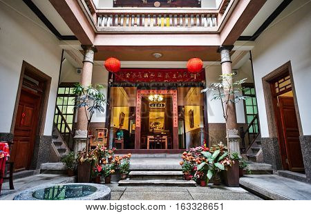 Xiluo, Taiwan - Mar. 12 : Traditional oriental chinese heritage building with spring couplets&red lantern in Taiwan (Chinese Translation on board : home full of wealth and blessing) at Mar. 12, 2016