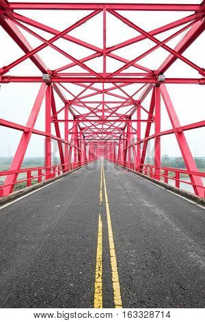 Symmetrical red steel structure construction of bridge and road in Xiluo Taiwan