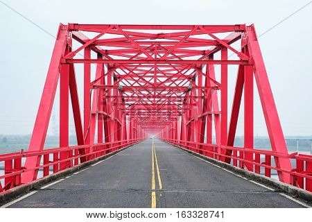 Symmetrical red steel structure construction of bridge and road in Xiluo Taiwan
