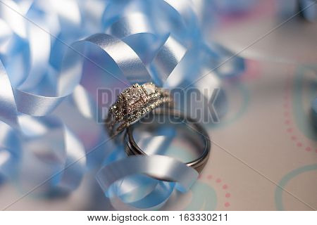 A pair of wedding rings on gift