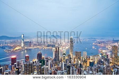 Business concept for real estate and corporate construction - panoramic modern city skyline bird eye aerial view with night sky in Hong Kong (HK) China