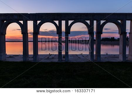 Sunset over the city lake in Bucharest. Port on Morii Lake Island