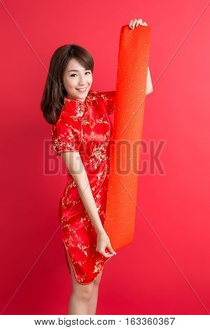 beauty woman wear cheongsam and show couplets with chinese new year