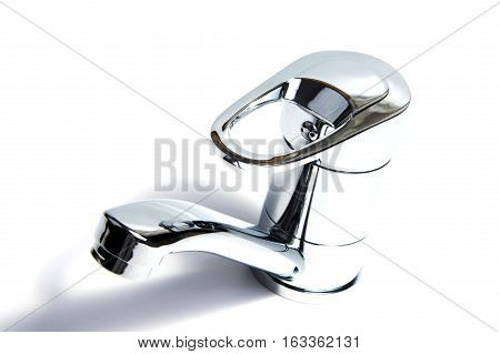 Modern stainless steel tap. Isolated on white background.