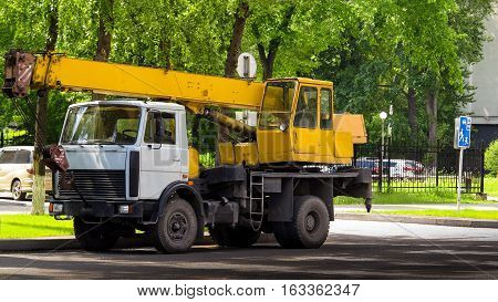 auto crane on the road on a warm summer day