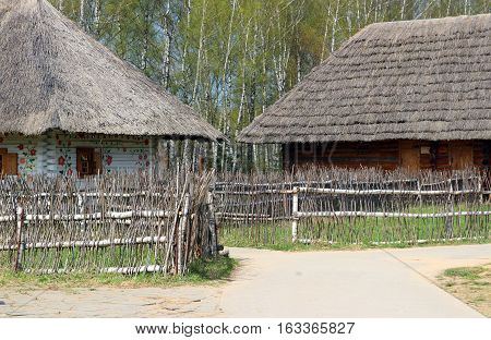 A couple of traditional ukrainian houses with painted ornaments, Moscow Ethnomir park, June 2016