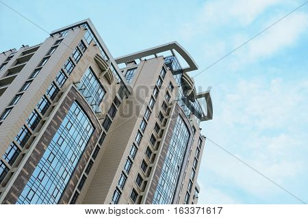 Multistorey apartment house on the sky background.