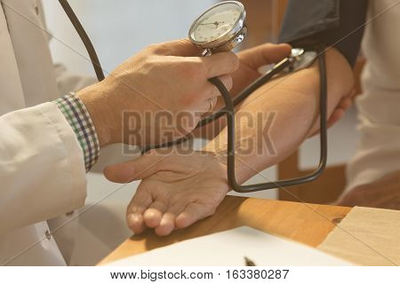 Doctor Checking Blood Pressure