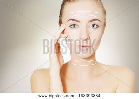 Closeup of female adult with  marks on skin for cosmetic medical procedures
