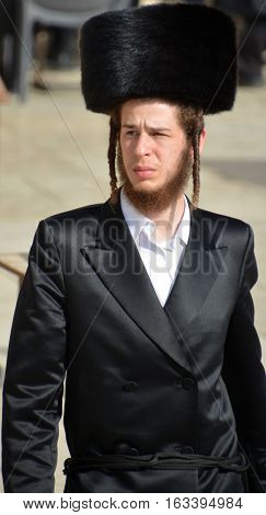 JERUSALEM ISRAEL 26 10 16: Jewish hasidic pray at the Western Wall, Wailing Wall the Place of Weeping is an ancient limestone wall in the Old City of Jerusalem. Second Jewish Temple by Herod the Great
