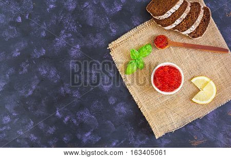 Red Caviar On Dark Background. Top View.