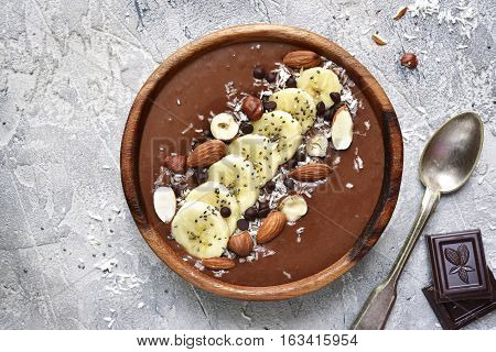 Chocolate Banana Smoothie Bowl With Nuts And Chia Seeds.top View.