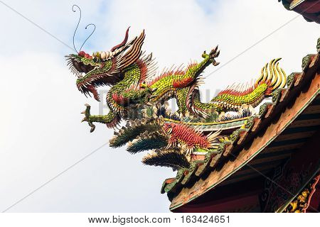 Asia culture concept - Roof with beautiful decoration of famous heritage landmark the traditional old oriental Chinese temple lungshan in Taipei Taiwan