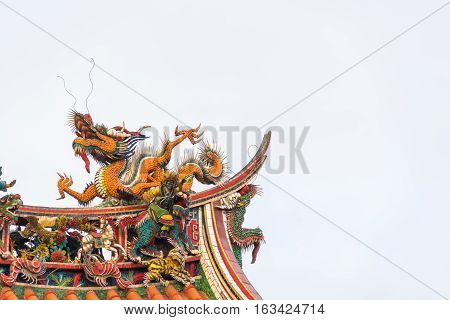 Asia culture concept - Roof with beautiful decoration of famous heritage landmark the traditional old oriental Chinese temple lungshan in Taipei Taiwan