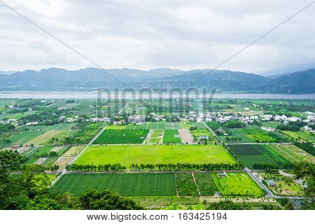 Panoramic bird eye aerial view of beautiful field and mountain under fantasy cloudy sky in Luyeh Hill Taitung the famous attractions in Taiwan
