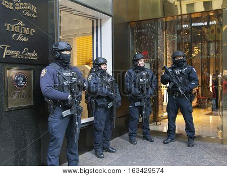 DECEMBER 19 - NEW YORK NEW YORK: Police officers stand guard in front of Trump Tower on 56th street and 5th avenue. Taken December 19 2016 in NYC.