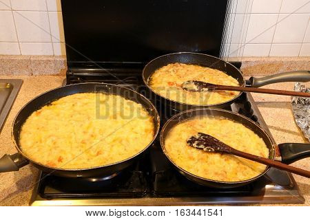 Three Large Pots With The Typical Dish Called Frico Of Italy