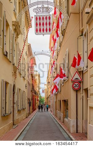 Monaco-Ville Monaco - November 4 2016: Tourists are walking on the narrow streets of Monaco-Ville.