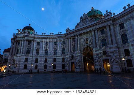 Famous hofburg palace in vienna in the evening, seen from michaelerplatz, austria