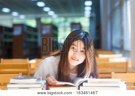 Happy Student Women Sittng On Wood Chair Light From Window For Reading Books