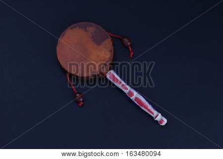 Damaru drum Twist Drum percussion instrument with a handle