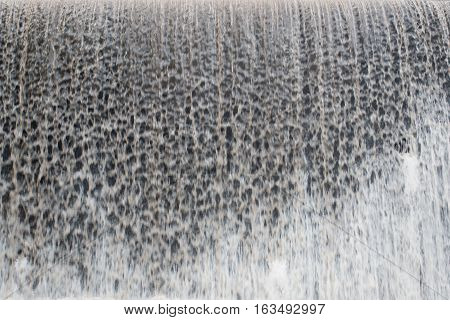 Water cascade waterfall pattern  in dam streaming splashes background