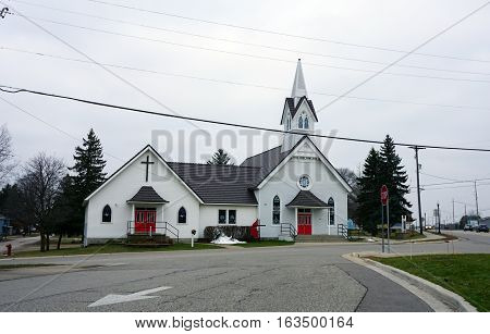 MANCELONA, MICHIGAN / UNITED STATES - NOVEMBER 27, 2016: The Mancelona United Methodist Church offers worship services in downtown Mancelona.