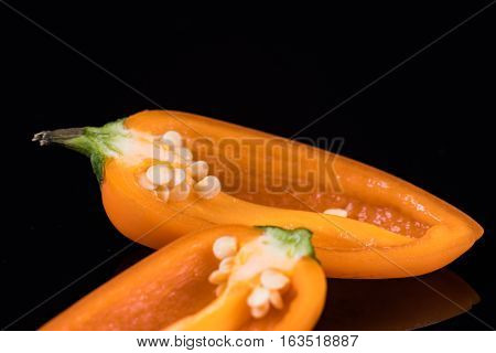 Orange sweet peppers isolated on a black background