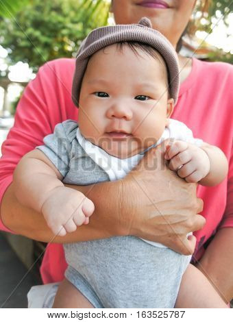 happy baby or a boy with his mom