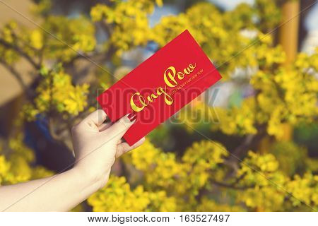 Hand Give Money In Red Envelopes - Ang Pow Or Red Packet To Someone For Chinese New Year / Tet Holid