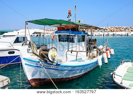 KALYVES, CRETE - SEPTEMBER 16, 2016 - Fishing boats moored in the harbour Kalyves Crete Greece Europe, September 16, 2016.
