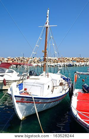 KALYVES, CRETE - SEPTEMBER 16, 2016 - Fishing boats moored in the harbour Kalyves Crete Greece Europe, September 16, 2016.