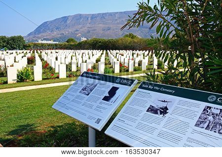 SUDA BAY, CRETE - SEPTEMBER 16, 2016 - View of the Souda Bay Allied War Cemetery with information boards in the foreground Souda Bay Crete Greece Europe, September 16, 2016.