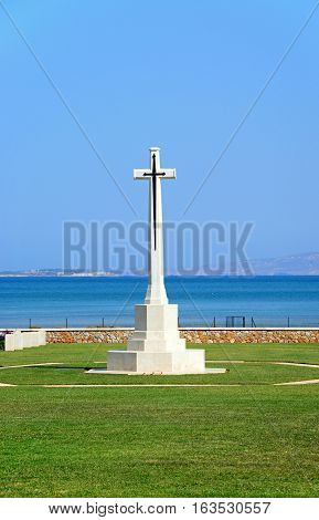 View of the Souda Bay Allied War Cemetery cross with the Aegean sea to the rear Souda Bay Crete Greece Europe.