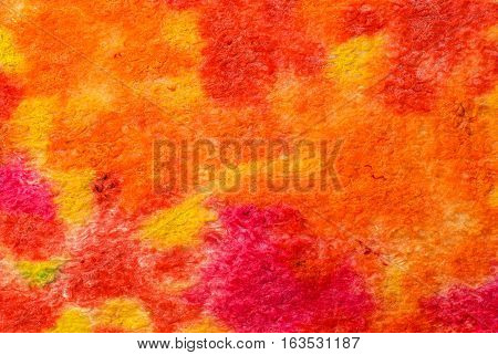 Multicolor abstract fabric texture of wool with stains . Craft background