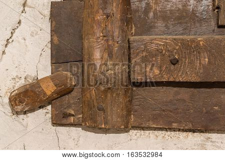 Wooden latch for an old window detail locks Wood with signs of woodworm vintage