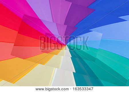 multicoloured wedges  seem a vortex of colours / effect  droste of multicoloured background