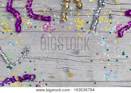 Carnival Confetti On Wood Background