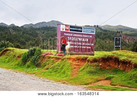 CUZCO, PERU - DECEMBER 11, 2013: Signboard of archaeological park Saqsaywaman in Cuzco, Peru, South America. Archaeological complex Cuzco