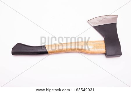Small hand axe with wooden black handle isolated on white background